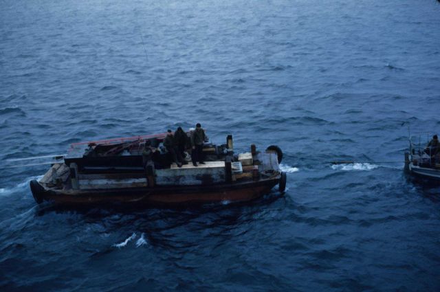 Building materials being taken to shore for shore camps at St Picture
