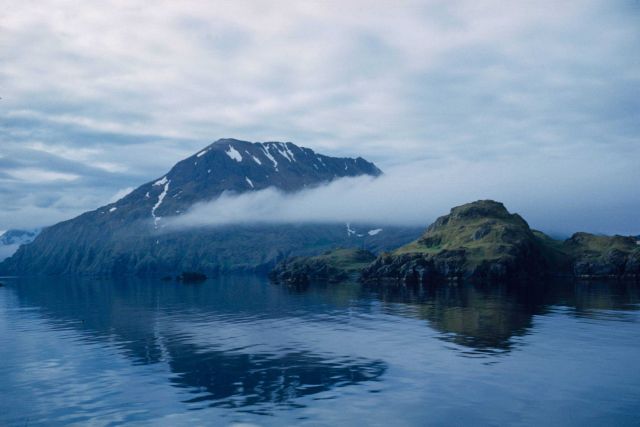 Low clouds and mountains while coming into Adak Harbor. Picture