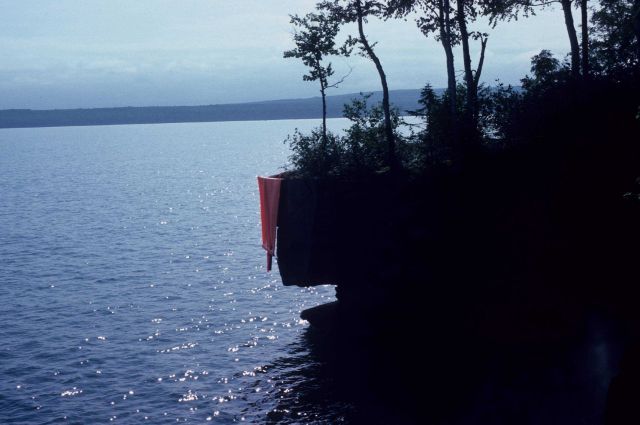 Orange banner hung off cliff to serve as hydrographic signal by crew off NOAA Ship PEIRCE. Picture