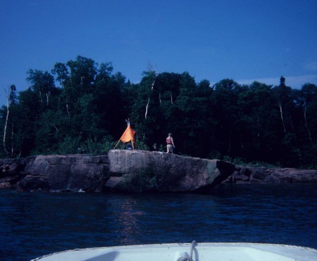 Lieutenant George Leigh setting up a target and light for geodetic survey observations. Picture