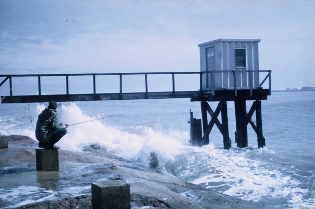 Multiple use - fishing next to a Coast and Geodetic Survey tide gauge house. Picture