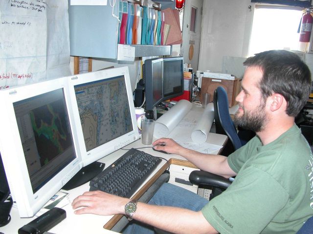 Processing hydrographic data on board the NOAA Ship RAINIER. Picture