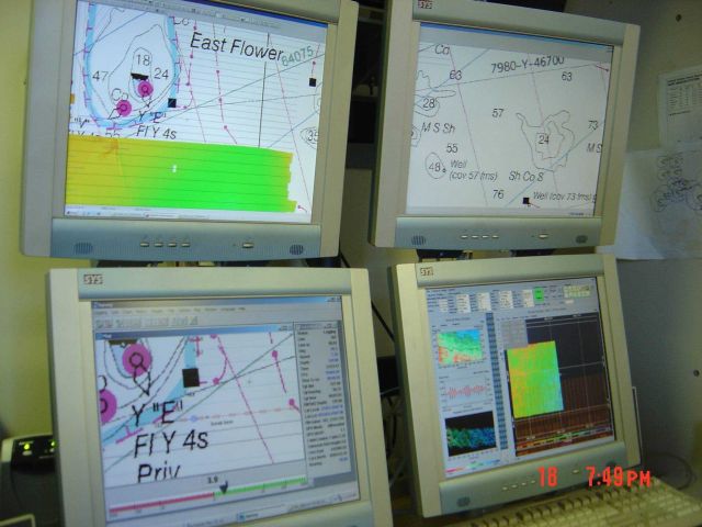 Computer displays associated with survey data acquisition and processing on the NOAA Ship THOMAS JEFFERSON. Picture
