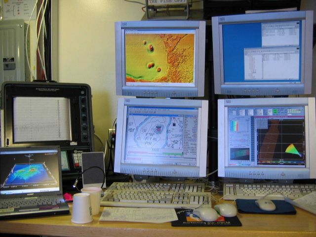 Computer displays associated with survey data acquisition and processing on the NOAA Ship THOMAS JEFFERSON. Picture