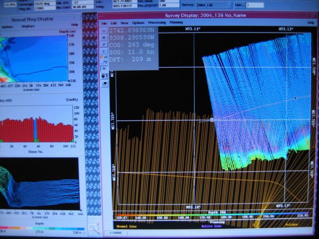 Computer displays associated with survey data acquisition and processing on the NOAA Ship THOMAS JEFFERSON. Picture