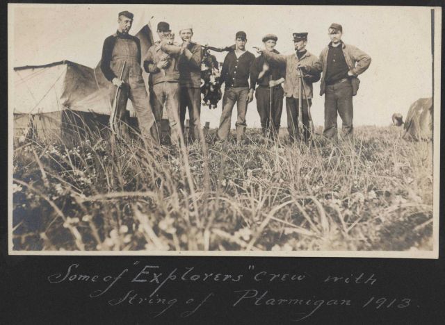 Some of EXPLORER's crew with a string of ptarmigan at a shore camp. Picture
