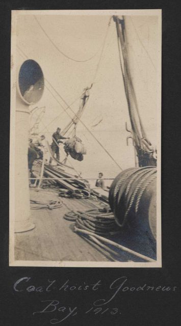 Coal being hoisted aboard Steamer EXPLORER from coal barge at Goodnews Bay Picture