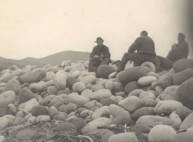 Building party stopped for lunch on a boulder beach Picture