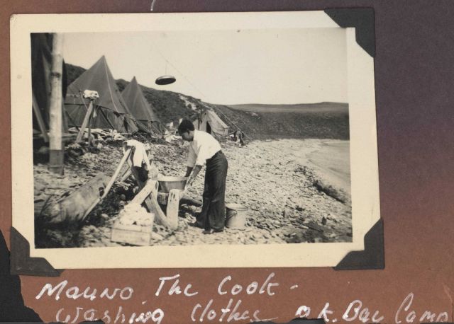 Mauno -the chief cook - washing clothes at OK Bay. Picture