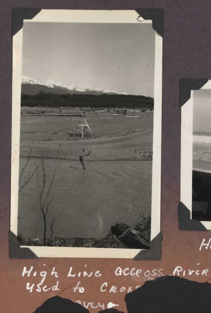 Surveyor crossing river on highline. Picture