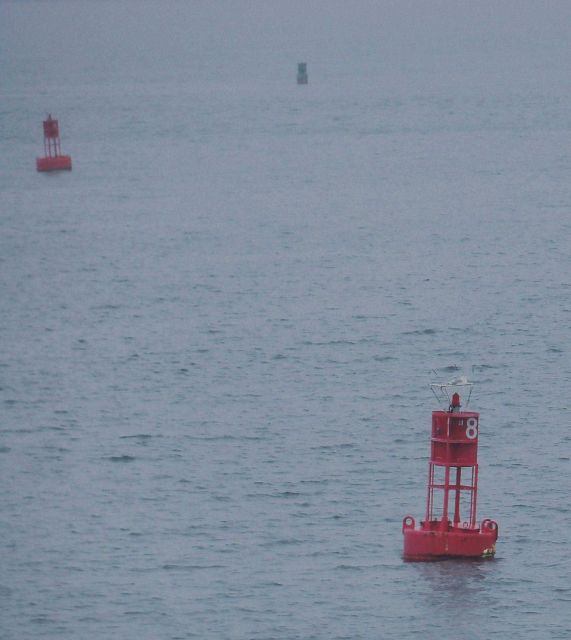 Channel indicating tight turn to starboard past second red buoy as next buoy in sight, a green buoy, must be kept to port when proceeding inbound. Picture