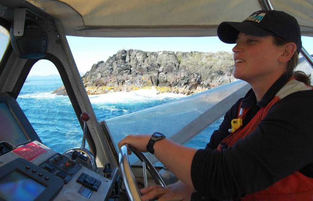 RAINIER survey launch conducting survey operations in close proximity to offshore rock. Picture