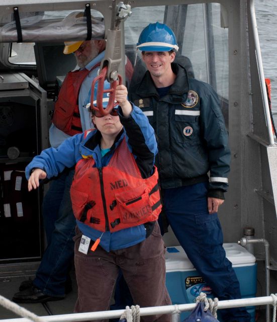 Securing the stern hook of a RAINIER survey launch Picture