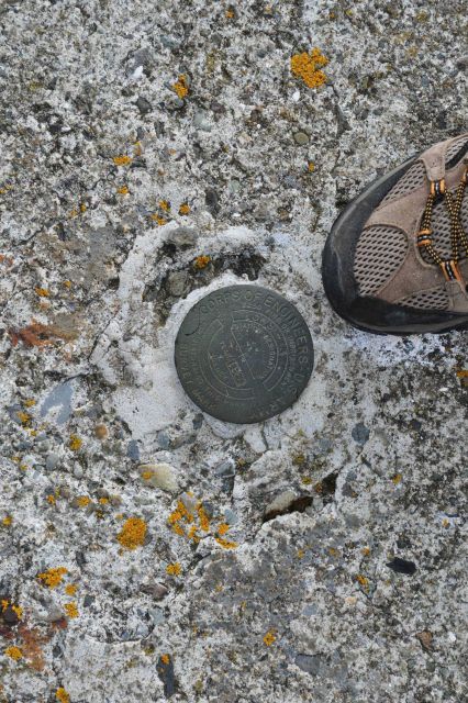 An Army Corps of Engineers survey disk on a coast artilley installation at Dutch Harbor. Picture