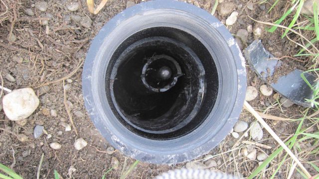 Rod driven to refusal in permafrost used as vertical survey control mark. Picture