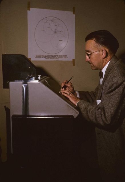 Coast and Geodetic Survey seismologist obtaining data to plot earthquake epicenter Picture