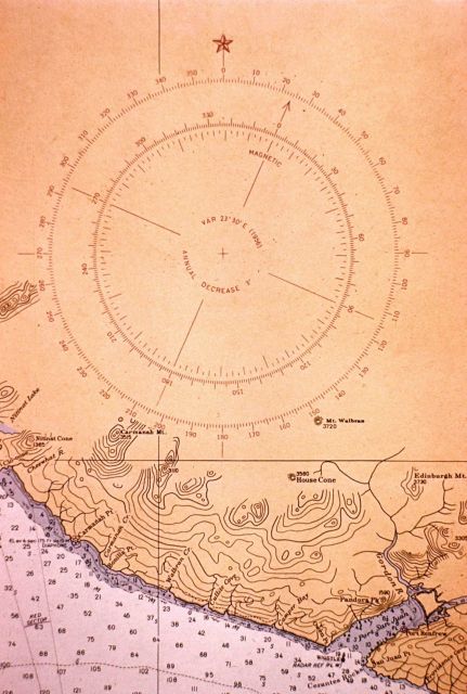 Compass rose for use by mariners in comparing magnetic direction with true direction. Picture