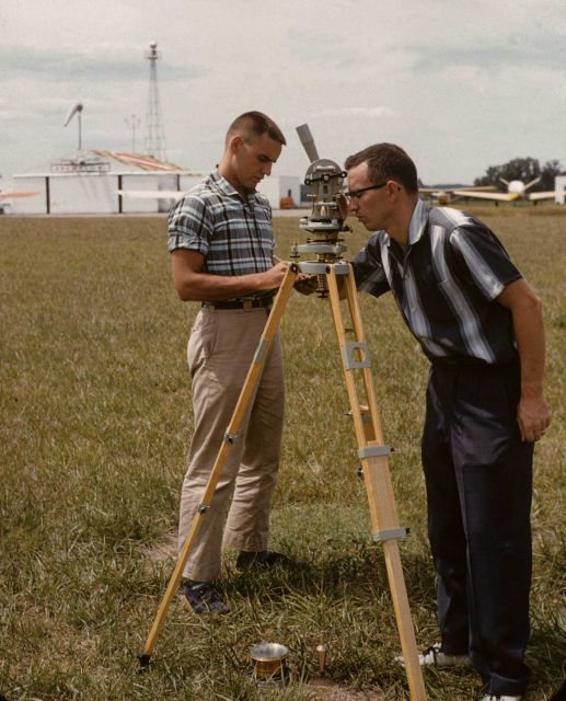 Surveyor taking sun azimuth for true direction to determine magnetic declination from magnetic observations. Picture