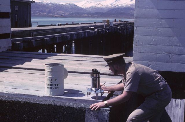 Operating a gravity meter. Picture