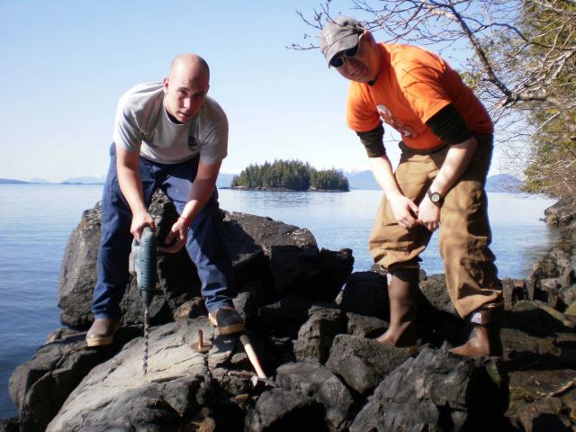 Setting bench marks for tidal leveling operations. Picture