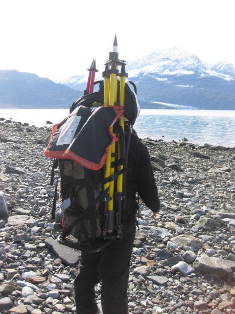 Backpacking horizontal control material to station site. Picture