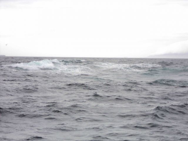 Breakers on an offshore rock probably noted on aerial photography. Picture