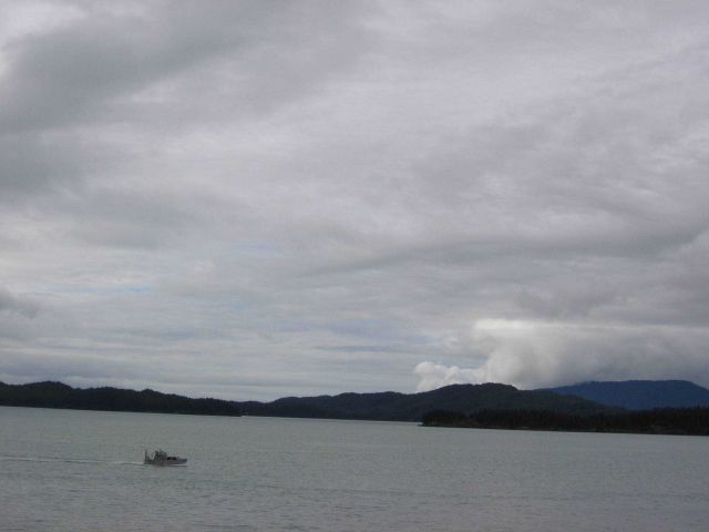 Study in gray - a gray survey launch on-line on a gray ocean with a gray sky. Picture