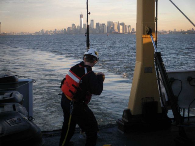 NOAA Corps Ensign Lindsey Norman retrieves a side scan sonar unit that NOAA Ship THOMAS JEFFERSON used to survey the Hudson River on a post-Sandy surv Picture