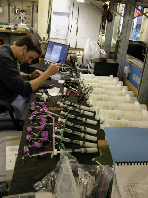Nathan Buck works on preparing his Automated Trace Element samplers to collect water at different depths for trace metal testing. Picture