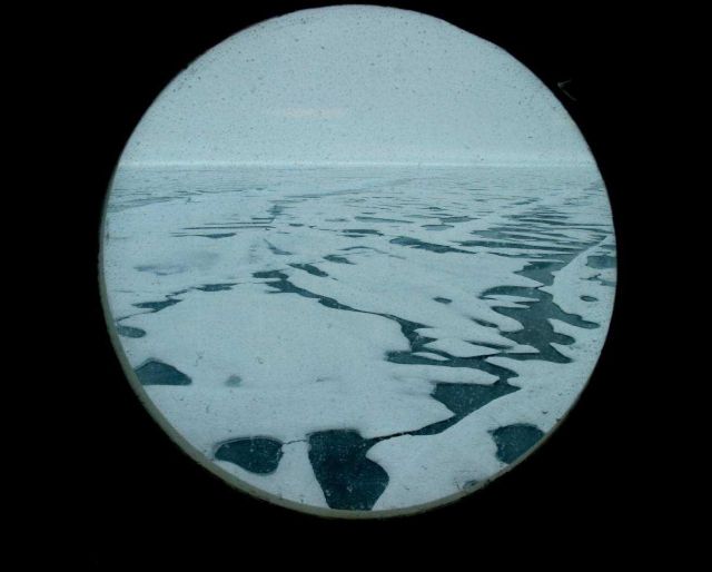 View of Arctic ice through one of Healy's portholes. Picture