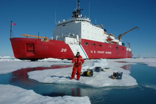Jeremy Potter tends the safety line for divers beneath the ice. Picture
