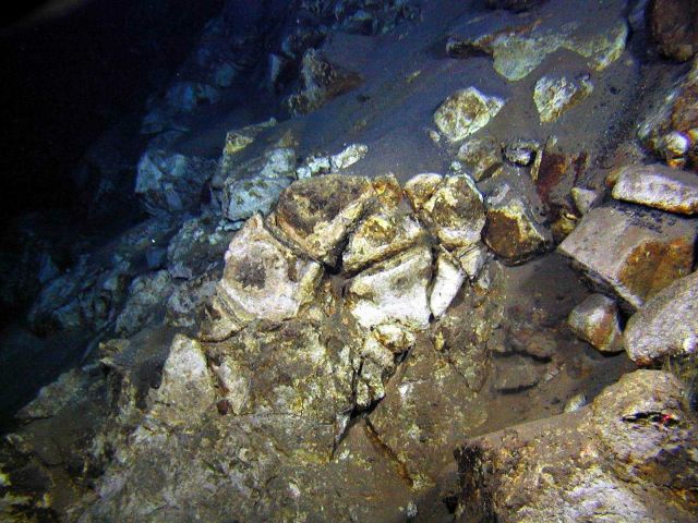Rocks that have been totally altered by hot (hydrothermal) fluids Picture