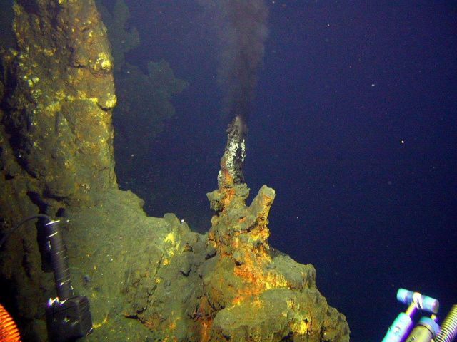 Metal rich high-temperature venting on the northwest caldera wall of Brothers Volcano produces these black smoker chimneys. Picture