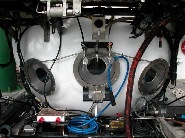 A closeup of the three viewports on the front of the PISCES V submersible which was the main vehicle used to explore the submarine volcanoes of the Ke Picture