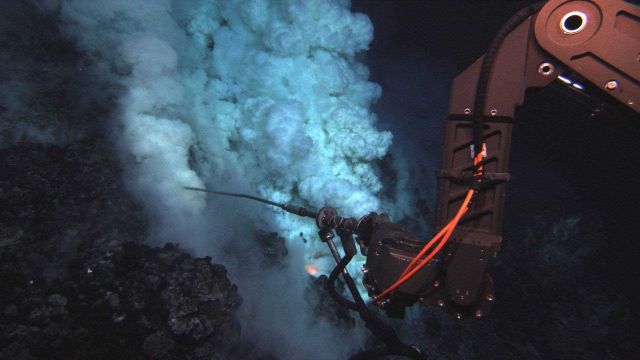 The Jason remotely-operated vehicle (ROV) samples fluid at an eruptive area near the summit of the West Mata Volcano Picture