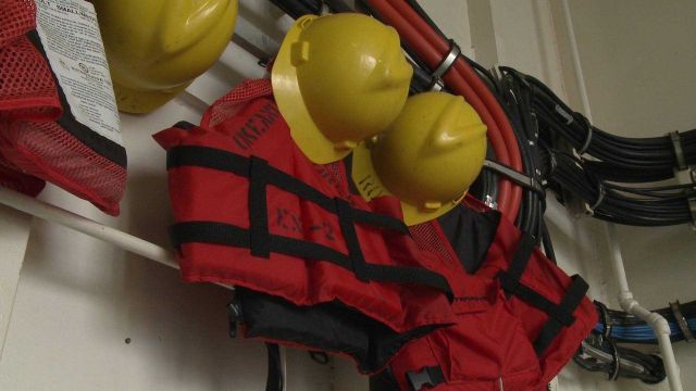 Hard hats and life vests for use by crew of OKEANOS EXPLORER for use during deck operations. Picture
