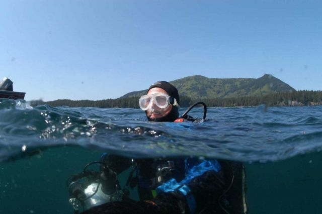 Dave McMahan, Alaska State Archaeologist, surfacing from dive on Kad'yak. Picture