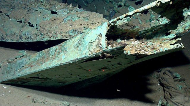Rudder in foreground and port side of vessel in upper left Picture