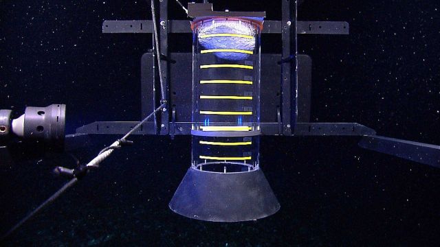 A 'methane bucket' capture device added to the front of the Little Hercules r remotely operated vehicle with gas hydrate (shiny material) at the top o Picture