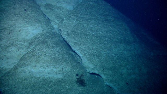 Nearly orthogonal failure surfaces along the canyon wall. Picture