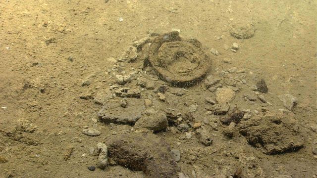 Pebbles, cobbles, and an unidentified annular structure. Picture