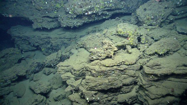 An area of failure with boulders and and large blocks of rock having sloughed off the canyon wall. Picture