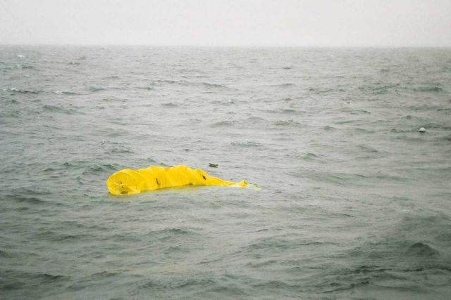 Deploying drogue attached to drifter buoy. Picture