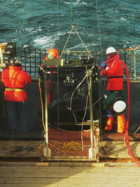 Hosing down nets on MOCNESS. Picture
