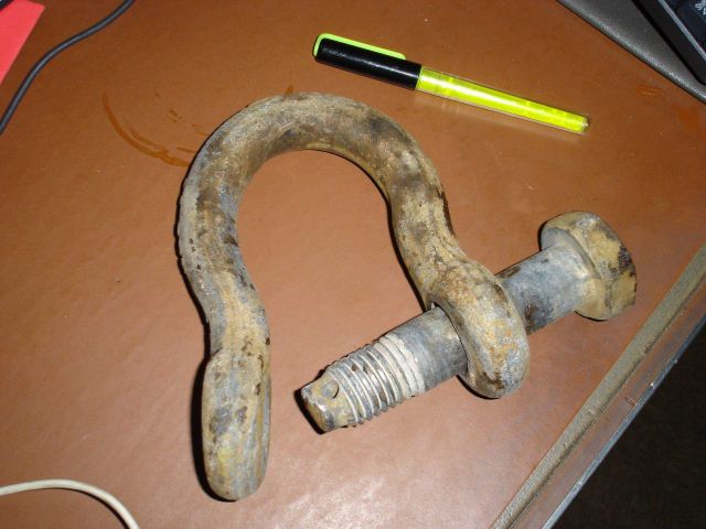 Bent door shackle indicative of forces sometimes involved in trawling operations . Picture