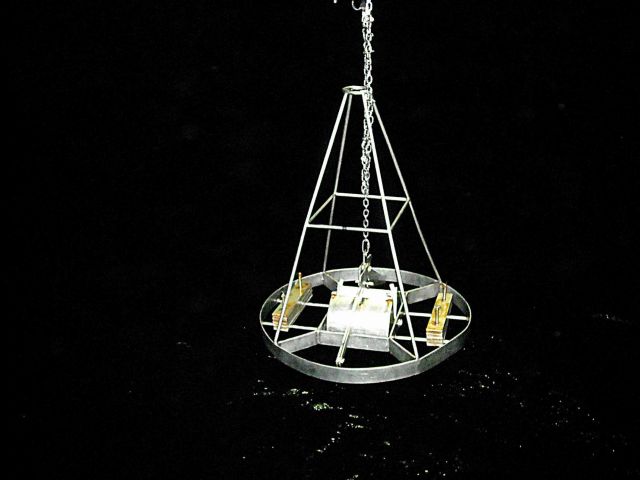 Around the clock operations - the Van Veen Grab sampler being deployed on a night watch off the NOAA Ship GORDON GUNTER. Picture