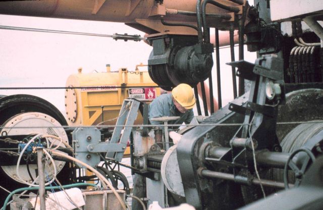 Ship's engineer working with a winch. Picture