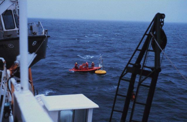 Servicing PEGGY, a meteorological and oceanographic buoy in the Aleutian Islands area. Picture