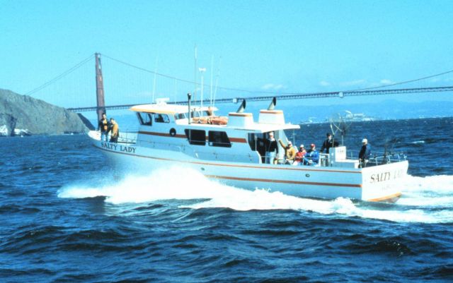 The charter vessel (CPFV) SALTY LADY racing across San Francisco Bay with the Golden Gate Bridge in the background. Picture