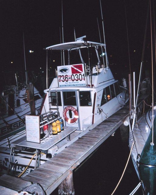 A charter dive boat moored at a marina Picture